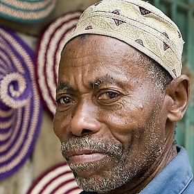Man with Baskets in Zanzibar - DavidDennisPhotos.com